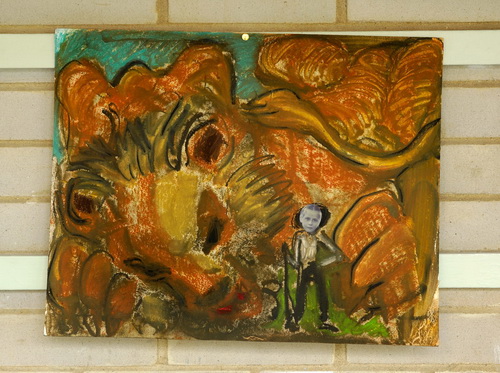 Pastel and mixed media drawing showing a huge yellow sleeping lion with the figure of a hunter with a gun collaged with a photo of Ruth Hartley as a child