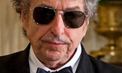 Portrait of Bob Dylan in dinner suit and shades