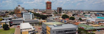 An aerial view of Lusaka taken from the north looking down the main tree-lined road known as Cairo Road.