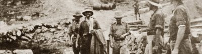 This rather poor quality photo shows Von Vorbeck at the centre walking towards the camera with a coat over his arm. He is escorted by a Soldier while 2 more stand at the right looking at him
